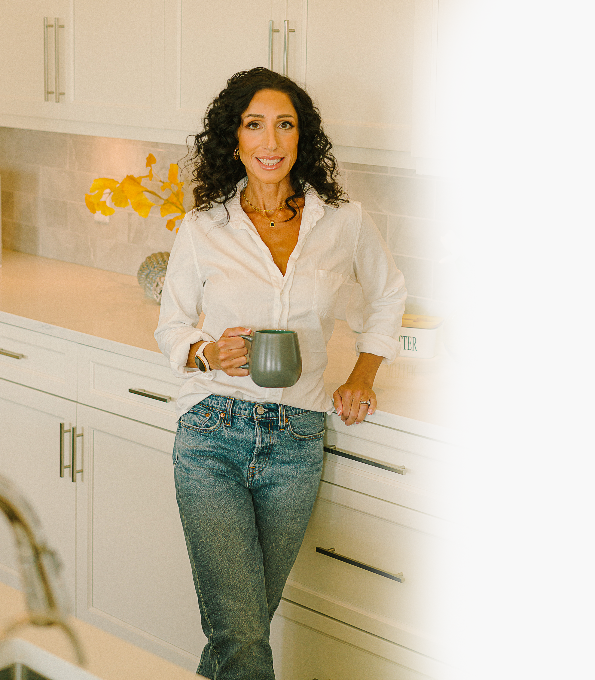 Dr. Michelle in kitchen holding a mug